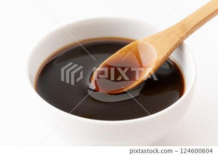 Close-up of a spoonful of thick sauce 124600604