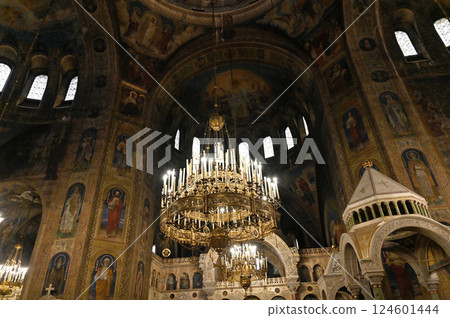 St. Alexander Nevsky Cathedral in the center of Sofia, capital of Bulgaria against the blue morning sky with colorful clouds. inside view 124601444