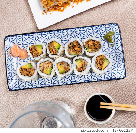 Set of rolls with fish and vegetables with Chinese chopsticks Set of rolls with fish and vegetables with Chinese chopsticks 124602237