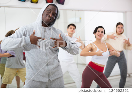 Group of multinational people practicing new modern dance techniques 124602261