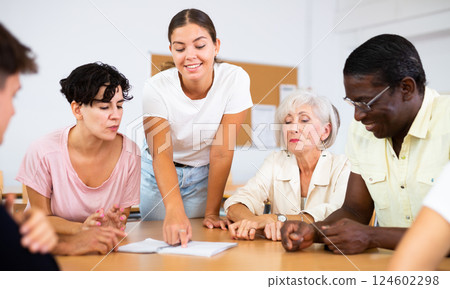 Group of people attending language course Group of people attending language course 124602298