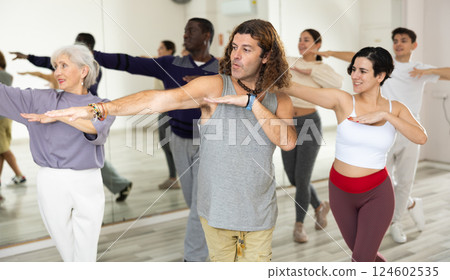 Emotional man learning dynamic dances in choreography class 124602535