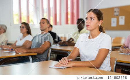 Attentive university students in advanced training courses in auditorium Attentive university students in advanced training courses in auditorium 124602538