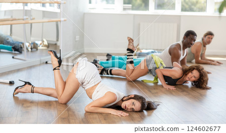 Female dancer performing contemporary sass dance floorwork in studio 124602677