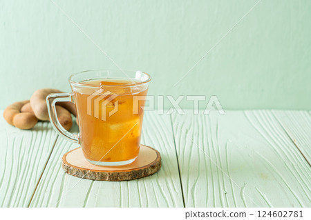 Delicious sweet drink tamarind juice and ice cube Delicious sweet drink tamarind juice and ice cube 124602781