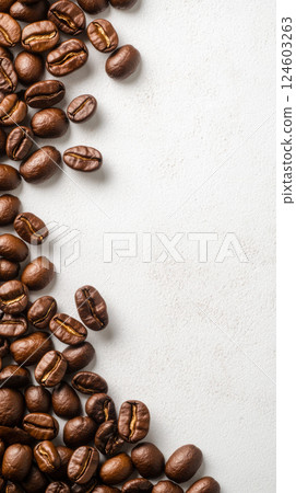 Coffee beans scattered on blank canvas background Coffee beans scattered on blank canvas background 124603263