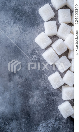 Sugar cubes on textured gray surface, top down view 124603340