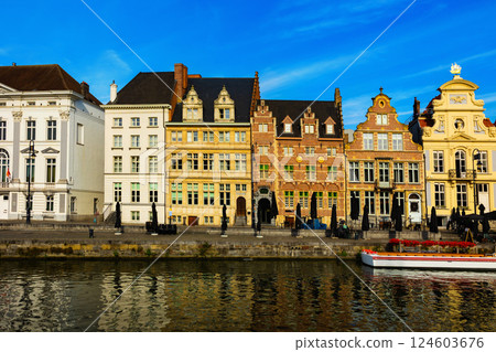 Medieval buildings in historical center of Ghent reflecting in water of river Leie Flanders Medieval buildings in historical center of Ghent reflecting in water of river Leie Flanders 124603676
