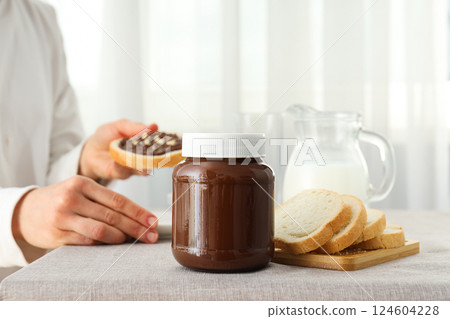 Bread with chocolate paste - tasty breakfast food 124604228