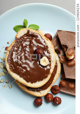 Bread with chocolate paste - tasty breakfast or morning food Bread with chocolate paste - tasty breakfast or morning food 124604234