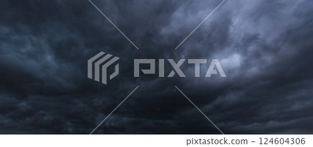The dark sky with heavy clouds converging and a violent storm before the rain.Bad or moody weather sky and environment. carbon dioxide emissions, greenhouse effect, global warming, climate change. The dark sky with heavy clouds converging and a violent storm before the rain.Bad or moody weather sky and environment. carbon dioxide emissions, greenhouse effect, global warming, climate change. 124604306