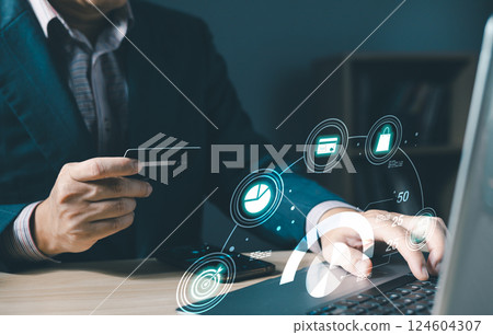businessman use credit card with laptop and  hologram credit report score to plan in e-business, and buy or purchase produce payment online. The concept of finance and online shopping. 124604307