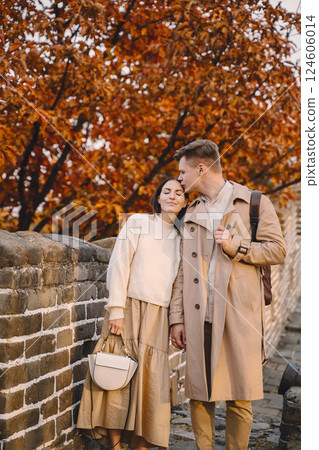 young couple kissing at the Great Wall of China. Newly married couple on their honeymoon to the Great Wall of China near Beijing China. young couple kissing at the Great Wall of China. Newly married couple on their honeymoon to the Great Wall of China near Beijing China. 124606014