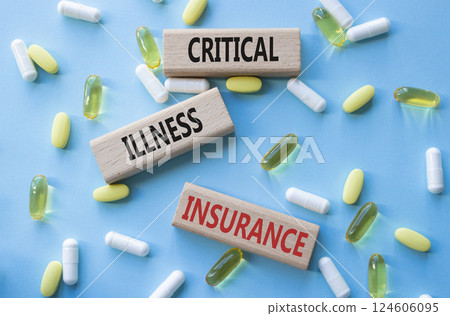 Critical Illness Insurance symbol. Concept word Critical Illness Insurance on wooden blocks. Beautiful blue background with pills. Medicine and Critical Illness Insurance concept. Copy space Critical Illness Insurance symbol. Concept word Critical Illness Insurance on wooden blocks. Beautiful blue background with pills. Medicine and Critical Illness Insurance concept. Copy space 124606095
