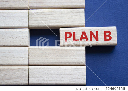 Plan B symbol. Concept word Plan B on wooden blocks. Beautiful deep blue background. Business and Plan B concept. Copy space. 124606136