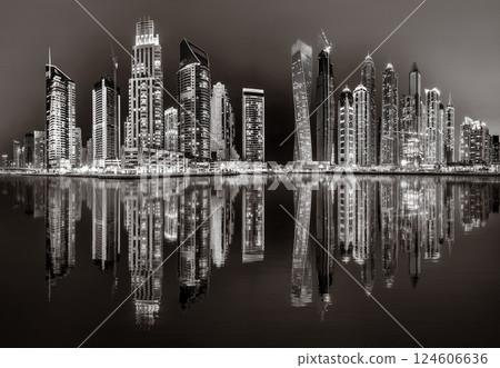 Skyscrapers and Urban city skyline over water, black and white style, city background, Dubai Marina bay UAE 124606636