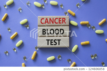 Cancer Blood Test symbol. Concept word Cancer Blood Test on wooden blocks. Beautiful purple background with pills. Medicine and Cancer Blood Test concept. Copy space Cancer Blood Test symbol. Concept word Cancer Blood Test on wooden blocks. Beautiful purple background with pills. Medicine and Cancer Blood Test concept. Copy space 124606858