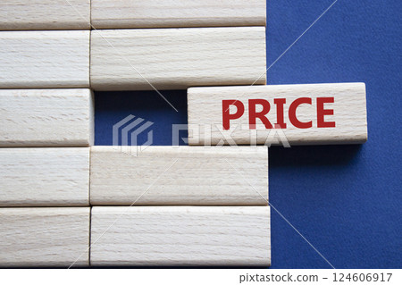 Price symbol. Concept word Price on wooden blocks. Beautiful deep blue background. Business and Price concept. Copy space. 124606917