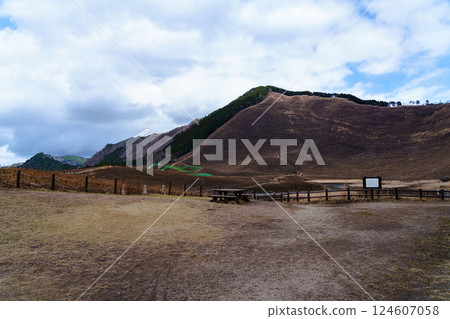 Soni Plateau before it is covered in fresh greenery after the mountain burn. View of Nihonboso from the entrance to the plateau. 124607058