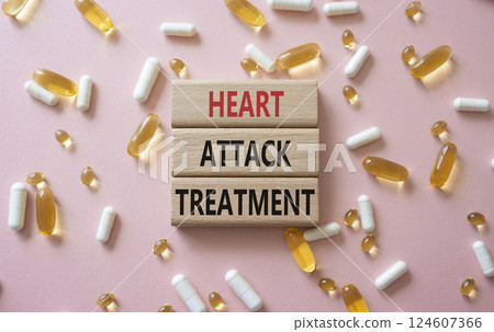 Heart Attack Treatment symbol. Concept word Heart Attack Treatment on wooden blocks. Beautiful pink background with pills. Medicine and Heart Attack Treatment concept. Copy space Heart Attack Treatment symbol. Concept word Heart Attack Treatment on wooden blocks. Beautiful pink background with pills. Medicine and Heart Attack Treatment concept. Copy space 124607366