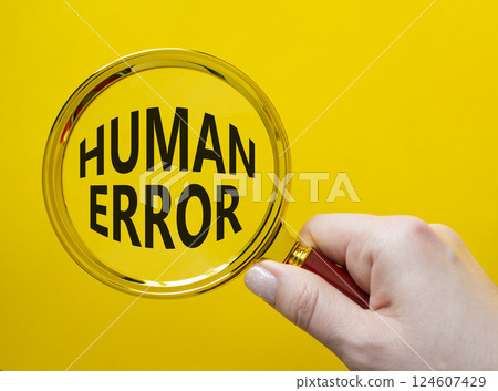 Human Error symbol. Magnifying glass with words Human Error. Businessman hand. Beautiful yellow background. Business and Human Error concept. Copy space. Human Error symbol. Magnifying glass with words Human Error. Businessman hand. Beautiful yellow background. Business and Human Error concept. Copy space. 124607429