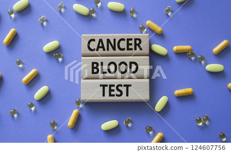Cancer Blood Test symbol. Concept word Cancer Blood Test on wooden blocks. Beautiful purple background with pills. Medicine and Cancer Blood Test concept. Copy space 124607756