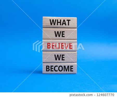 What we Believe we Become symbol. Concept words What we Believe we Become on wooden blocks. Beautiful blue background. Business concept. Copy space. 124607770