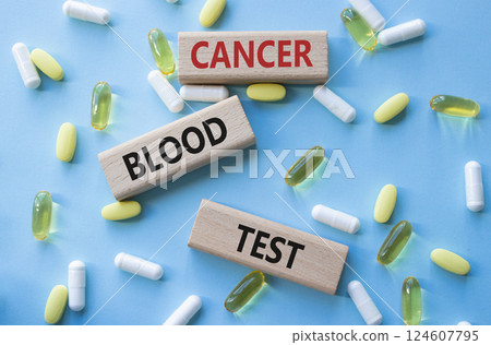 Cancer Blood Test symbol. Concept word Cancer Blood Test on wooden blocks. Beautiful blue background with pills. Medicine and Cancer Blood Test concept. Copy space Cancer Blood Test symbol. Concept word Cancer Blood Test on wooden blocks. Beautiful blue background with pills. Medicine and Cancer Blood Test concept. Copy space 124607795