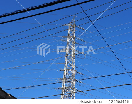 The railroad tracks continue. Electric wires and sky. The blue sky feels good. Copy space. The railroad tracks continue. Electric wires and sky. The blue sky feels good. Copy space. 124608416