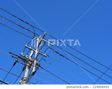 The railroad tracks continue. Electric wires and sky. The blue sky feels good. Copy space. The railroad tracks continue. Electric wires and sky. The blue sky feels good. Copy space. 124608481