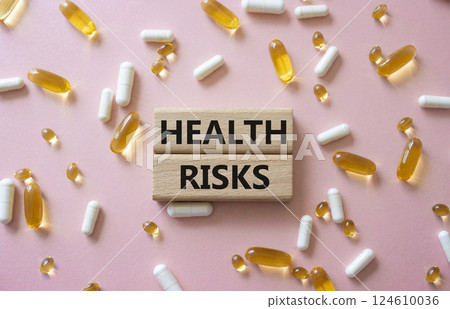 Health Risks symbol. Concept word Health Risks on wooden blocks. Beautiful pink background with pills. Medicine and Health Risks concept. Copy space Health Risks symbol. Concept word Health Risks on wooden blocks. Beautiful pink background with pills. Medicine and Health Risks concept. Copy space 124610036