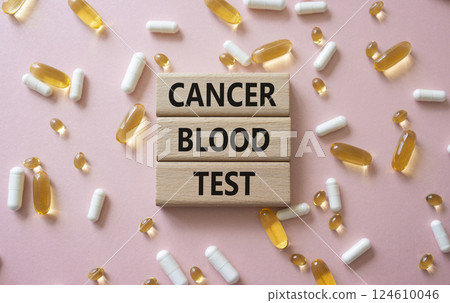 Cancer Blood Test symbol. Concept word Cancer Blood Test on wooden blocks. Beautiful pink background with pills. Medicine and Cancer Blood Test concept. Copy space Cancer Blood Test symbol. Concept word Cancer Blood Test on wooden blocks. Beautiful pink background with pills. Medicine and Cancer Blood Test concept. Copy space 124610046