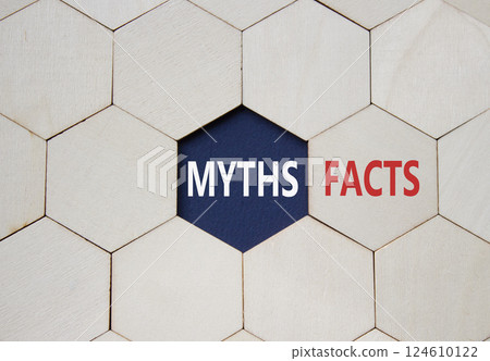 Facts or Myths symbol. Concept word Facts or Myths on wooden comb puzzle. Beautiful deep blue background. Business and Facts or Myths concept. Copy space 124610122