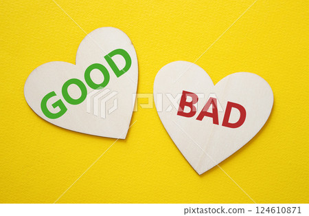Good or Bad symbol. Concept word Good or Bad on wooden puzzle. Beautiful yellow background. Business and Good or Bad concept. Copy space 124610871