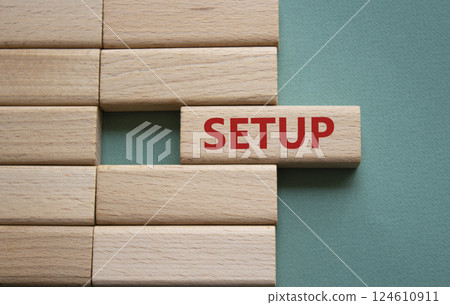 Setup symbol. Wooden blocks with word Setup. Beautiful grey green background. Setup concept. Copy space. 124610911