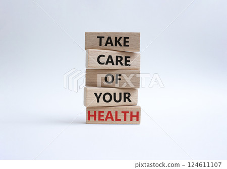 Health symbol. Wooden blocks with words Take Care of your Health. Beautiful white background. Health concept. Copy space. Health symbol. Wooden blocks with words Take Care of your Health. Beautiful white background. Health concept. Copy space. 124611107