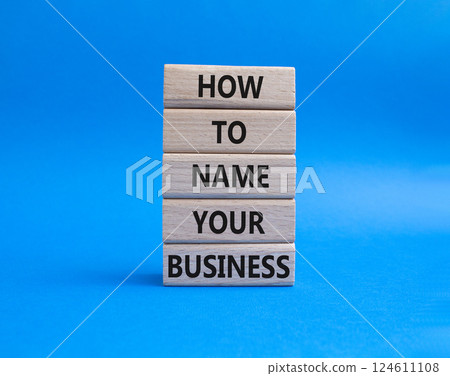 Business symbol. Wooden blocks with words How to name your Business. Beautiful blue background. Business How to name your Business concept. Copy space. 124611108