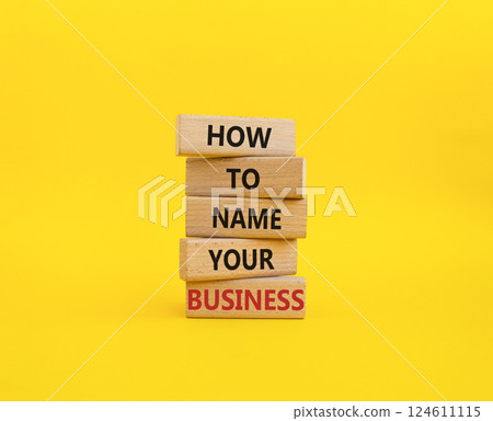 Business symbol. Wooden blocks with words How to name your Business. Beautiful yellow background. Business How to name your Business concept. Copy space. Business symbol. Wooden blocks with words How to name your Business. Beautiful yellow background. Business How to name your Business concept. Copy space. 124611115