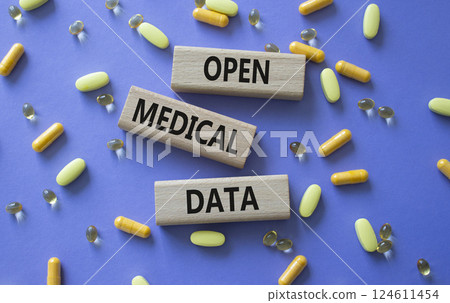 Open Medical Data symbol. Concept word Open Medical Data on wooden blocks. Beautiful purple background with pills. Medicine and Open Medical Data concept. Copy space Open Medical Data symbol. Concept word Open Medical Data on wooden blocks. Beautiful purple background with pills. Medicine and Open Medical Data concept. Copy space 124611454