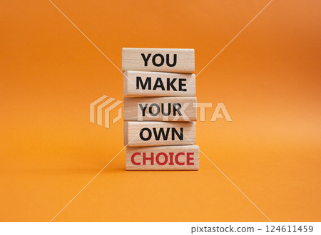 Make your Choice symbol. Concept words You Make your own Choice on wooden blocks. Beautiful orange background. Business and You Make your own Choice concept. Copy space. 124611459
