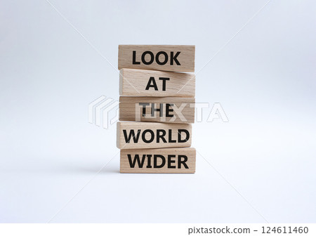 Look at the world wider symbol. Wooden blocks with words Look at the world wider. Beautiful white background. Business and Look at the world wider concept. Copy space. 124611460