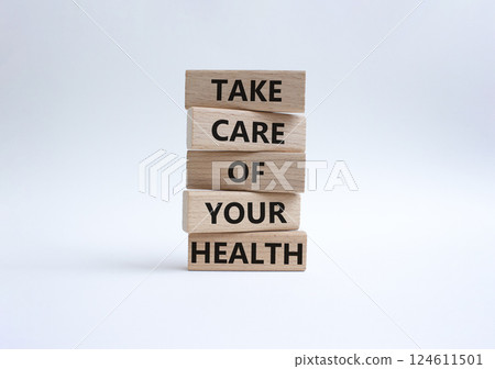 Health symbol. Wooden blocks with words Take Care of your Health. Beautiful white background. Health concept. Copy space. 124611501