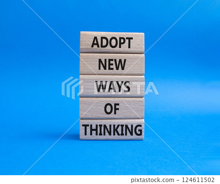 Adopt new ways of thinking symbol. Wooden blocks with words Adopt new ways of thinking. Beautiful blue background. Business and Adopt new ways of thinking concept. Copy space. 124611502