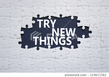 Try new Things symbol. Concept words Try new Things on white puzzle. Beautiful deep blue background. Business and Try new Things concept. Copy space. 124611562