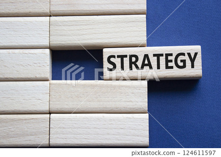 Strategy symbol. Concept word Strategy on wooden blocks. Beautiful deep blue background. Business and Strategy concept. Copy space. Strategy symbol. Concept word Strategy on wooden blocks. Beautiful deep blue background. Business and Strategy concept. Copy space. 124611597