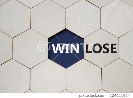 Win or Lose symbol. Concept word Win or Lose on wooden comb puzzle. Beautiful deep blue background. Business and Win or Lose concept. Copy space 124611634
