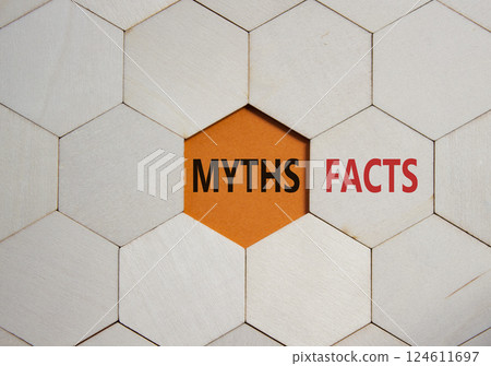 Facts or Myths symbol. Concept word Facts or Myths on wooden comb puzzle. Beautiful orange background. Business and Facts or Myths concept. Copy space Facts or Myths symbol. Concept word Facts or Myths on wooden comb puzzle. Beautiful orange background. Business and Facts or Myths concept. Copy space 124611697