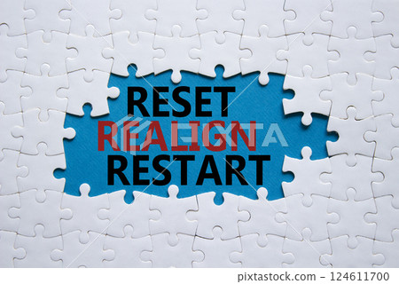 Reset Realign Restart symbol. Concept words Reset Realign Restart on white puzzle. Beautiful blue background. Business and Reset Realign Restart concept. Copy space. 124611700