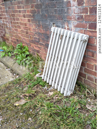 AN Abandoned Dumped Radiator Heater Left Against a Wall AN Abandoned Dumped Radiator Heater Left Against a Wall 124611814