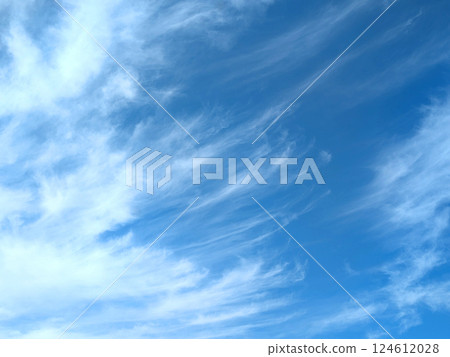 Wispy high-altitude delicate feathery white clouds in the sky Wispy high-altitude delicate feathery white clouds in the sky 124612028